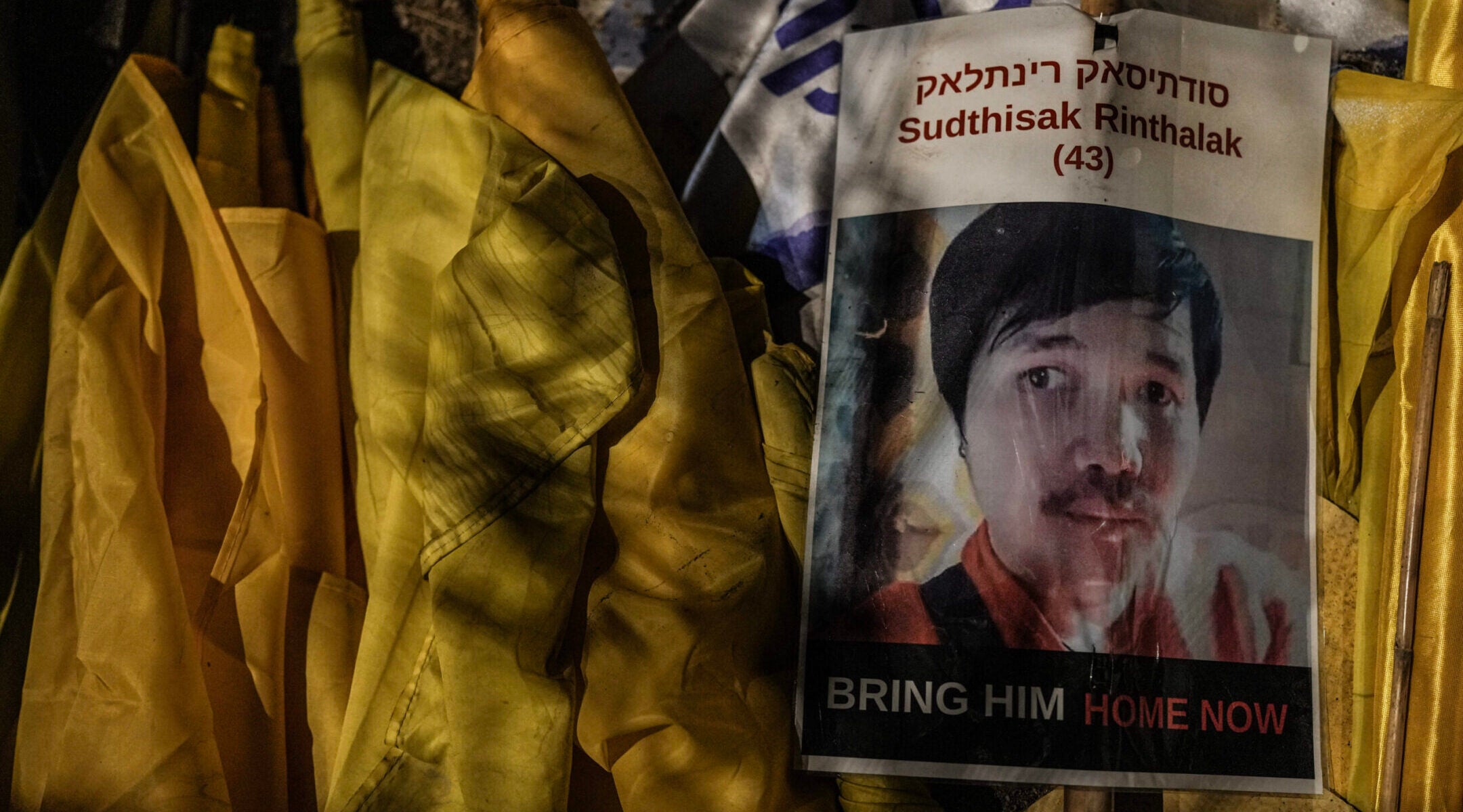 Israelis attend a rally outside the southern Israeli city of Sderot, calling for the release of slain hostages Ran Gvili and Sudthisak Rinthalak, whose bodies are still held by Hamas in Gaza, Nov. 29, 2025. 
