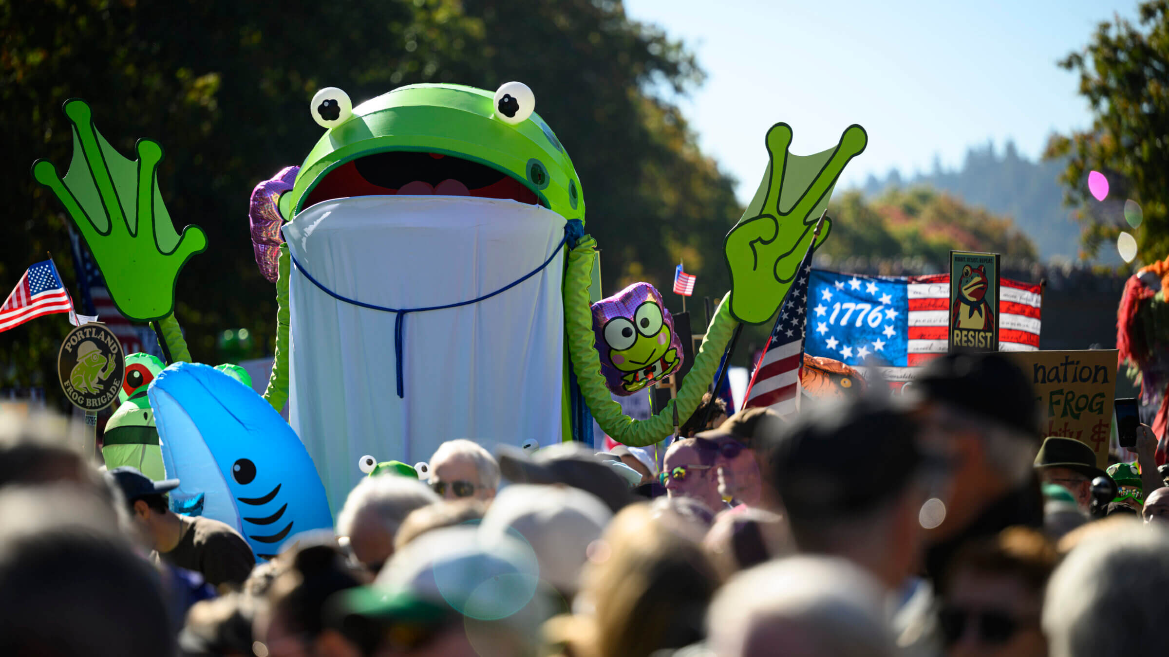 A demonstrator in a frog costume attends a "No Kings" march in Portland, Oregon.