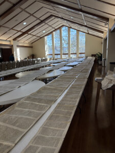 The Torah scrolls from the sanctuary of Beth Israel Congregation survived an arson attack. They were later unfurled at a nearby church to air out from soot and smoke.