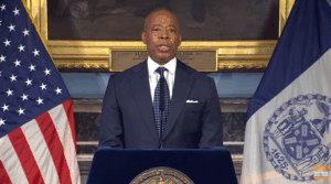 Eric Adams speaking from a podium.
